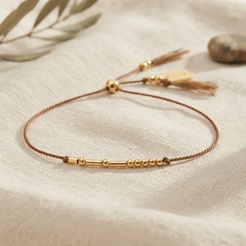 Handmade Morse code bracelet, gold beads on a silk cord